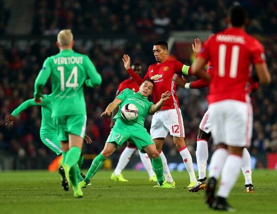 Romain Hamouma of Saint Etienne challenges Chris Smalling of Manchester United ManU during the UEFA Europa League Round of 32 1st leg match at Old Trafford Stadium, Manchester. Picture date: February 16th, 2017. Pic credit should read: Matt McNulty Sportimage EDITORIAL USE ONLY. No use with unauthorised audio, video, data, fixture lists, club league logos or live services. Online in-match use limited to 120 images, no video emulation. No use in betting, games or single club league player publications.