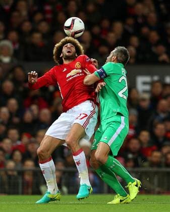 Marouane Fellaini of Manchester United ManU and Loic Perrin of Saint Etienne during the UEFA Europa League Round of 32 1st leg match at Old Trafford Stadium, Manchester. Picture date: February 16th, 2017. Pic credit should read: Matt McNulty Sportimage EDITORIAL USE ONLY. No use with unauthorised audio, video, data, fixture lists, club league logos or live services. Online in-match use limited to 120 images, no video emulation. No use in betting, games or single club league player publications.