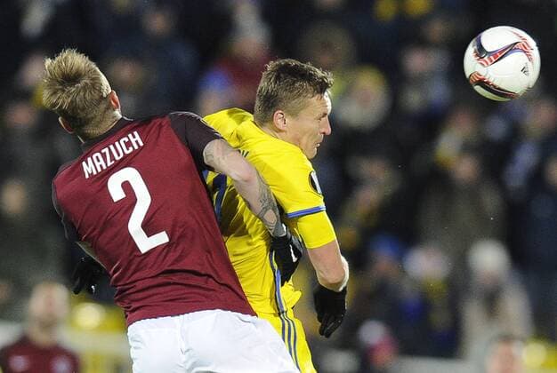 ROSTOV-ON-DON, RUSSIA - FEBRUARY 16, 2017: AC Sparta Pragueâ€™s Ondrej Mazuch (L) and FC Rostovâ€™s Aleksandr Bukharov fight for the ball in their 2016-17 UEFA Europa League Round of 32, 1st leg football match at Olimp 2 Stadium. FC Rostov won the game 4-0. Valery Matytsin TASS  TS041790