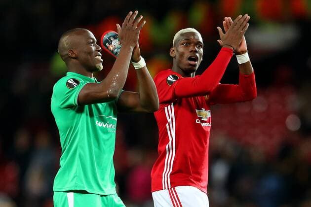 Paul Pogba of Manchester United ManU and brother Florentin Pogba of Saint Etienne at full time during the UEFA Europa League Round of 32 1st leg match at Old Trafford Stadium, Manchester. Picture date: February 16th, 2017. Pic credit should read: Matt McNulty Sportimage EDITORIAL USE ONLY. No use with unauthorised audio, video, data, fixture lists, club league logos or live services. Online in-match use limited to 120 images, no video emulation. No use in betting, games or single club league player publications.