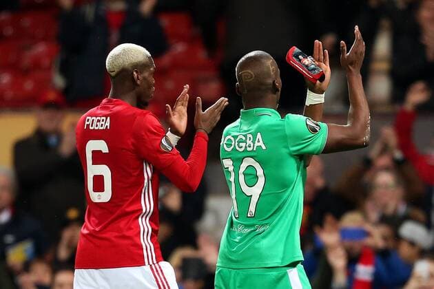 Paul Pogba of Manchester United ManU and brother Florentin Pogba of Saint Etienne at full time during the UEFA Europa League Round of 32 1st leg match at Old Trafford Stadium, Manchester. Picture date: February 16th, 2017. Pic credit should read: Matt McNulty Sportimage EDITORIAL USE ONLY. No use with unauthorised audio, video, data, fixture lists, club league logos or live services. Online in-match use limited to 120 images, no video emulation. No use in betting, games or single club league player publications.