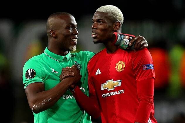 Florentin Pogba of Saint Etienne holds personalised shin pads showing his brother Paul Pogba in Manchester United ManU and Juventus strips during the UEFA Europa League Round of 32 1st leg match at Old Trafford Stadium, Manchester. Picture date: February 16th, 2017. Pic credit should read: Matt McNulty Sportimage EDITORIAL USE ONLY. No use with unauthorised audio, video, data, fixture lists, club league logos or live services. Online in-match use limited to 120 images, no video emulation. No use in betting, games or single club league player publications.