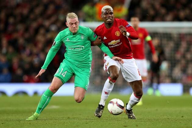 Paul Pogba of Manchester United ManU challenges Jordan Veretout of Saint Etienne during the UEFA Europa League Round of 32 1st leg match at Old Trafford Stadium, Manchester. Picture date: February 16th, 2017. Pic credit should read: Matt McNulty Sportimage EDITORIAL USE ONLY. No use with unauthorised audio, video, data, fixture lists, club league logos or live services. Online in-match use limited to 120 images, no video emulation. No use in betting, games or single club league player publications.