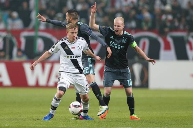 16.02.2017, Warszawa, pilka nozna, Liga Europy, Legia Warszawa - Ajax Amsterdam, Michal Kopczynski (Legia), Hakim Ziyech (Ajax), Davy Klaassen (Ajax) at the Legia Warsaw versus Ajax Amsterdam, UEFA Europa League tie xTomaszxJastrzebowskix  ActionPlus11847024