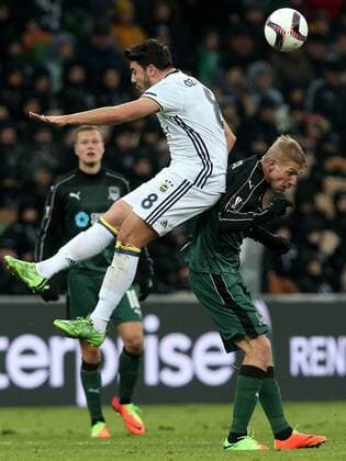 KRASNODAR, RUSSIA - FEBRUARY 16, 2017: Fenerbahce Istanbulâ€™s Ozan Tufan (L) and FC Krasnodar s Yuri Gazinski fight for the ball in their 2016-17 UEFA Europa League Round of 32, 1st leg football match at Krasnodar Stadium. FC Krasnodar won the game 1-0. Vitaly Timkiv TASS  TS04175C