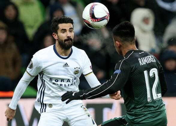 KRASNODAR, RUSSIA - FEBRUARY 16, 2017: Fenerbahce Istanbulâ€™s Alper Potuk (L) and FC Krasnodar s Cristian Ramirez fight for the ball in their 2016-17 UEFA Europa League Round of 32, 1st leg football match at Krasnodar Stadium. FC Krasnodar won the game 1-0. Vitaly Timkiv TASS  TS04175F