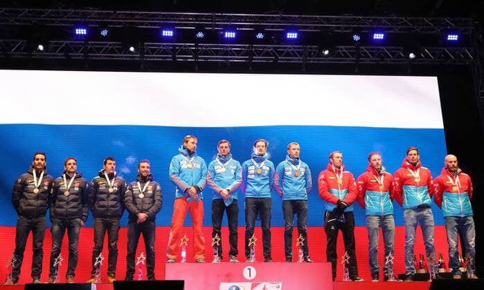 HOCHFILZEN, AUSTRIA - FEBRUARY 18, 2017: Silver medallists Martin Fourcade, Simon Desthieux, Quentin Fillon Maillet, and Jean Guillaume Beatrix of France, gold medallists Anton Shipulin, Anton Babikov, Maxim Tsvetkov, and Alexei Volkov of Russia, bronze medallists Dominik Landertinger, Simon Eder, Julian Eberhard, Daniel Mesotitsch of Austria, from left, pose at a victory ceremony for the men s 4x7.5km relay at the 2017 IBU Biathlon World Championships in Hochfilzen, Austria. Stanislav Krasilnikov TASS TS041D24