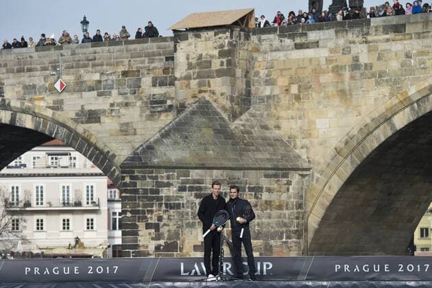 Switzerland s tennis player Roger Federer, right, and Czech Republic s Tomas Berdych, left, pose for a photo during a exhibition match on Vltava river in Prague, Czech Republic, Monday, February 20, 2017. Federer arrived in Prague to promote the Laver Cup, a tournament that will be held in Prague on Sept. 22-24, 2017, pitting six top European players against their counterparts from the rest of the world. The Charles Bridge is in the background. (CTKxPhoto MichalxKamaryt) CTKPhotoP201702200369701 kmt 3