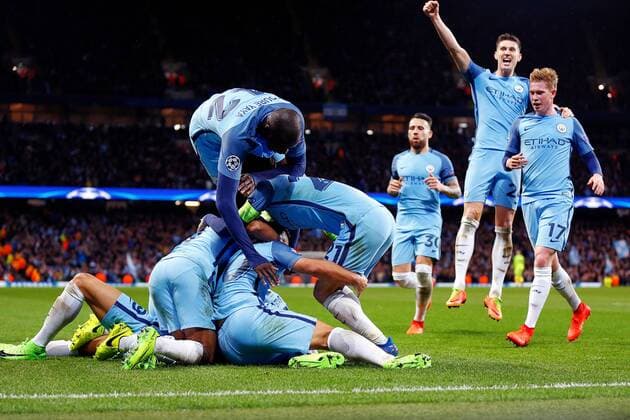 February 21st 2017, Etihad Stadium, Manchester, Lancashire, England; UEFA Champions League 1st Leg round of 16, Manchester City versus AS Monaco; The Manchester City players celebrate by diving on Leroy Sane of Manchester City who scored the fifth goal in the 82nd minute xPaulxKeevilx  ActionPlus11849101