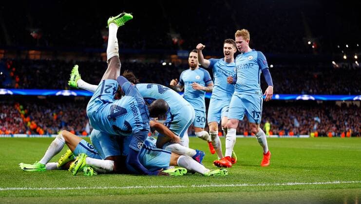 February 21st 2017, Etihad Stadium, Manchester, Lancashire, England; UEFA Champions League 1st Leg round of 16, Manchester City versus AS Monaco; The Manchester City players celebrate by diving on Leroy Sane of Manchester City who scored the fifth goal in the 82nd minute xPaulxKeevilx  ActionPlus11849102