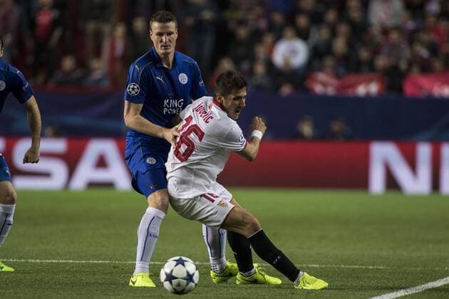 February 22, 2017 - Seville, Spain - Stevan Jovetic of Sevilla (R ) receives a foul during the UEFA Champions League Round of 16 (first leg) soccer match between Sevilla FC and Leicester at Estadio Ramon Sanchez Pizjuan Soccer 2017 - Sevilla FC vs Leicester - ZUMAa142 20170222_zap_a142_023 Copyright: xDanielxGonzalezxAcunax