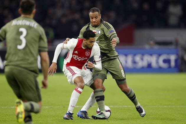 (L-R) Tomasz Jodlowiec of Legia Warszawa, Jairo Riedewald of Ajax, Vadis Odjidja of Legia Warszawaduring the UEFA Europa League round of 16 match between Ajax Amsterdam and Legia Warsaw at the Amsterdam Arena on February 23, 2017 in Amsterdam, The Netherlands Ajax v Legia Warschau UEFA Europa League 2016 2017 xVIxxIVx 7183795