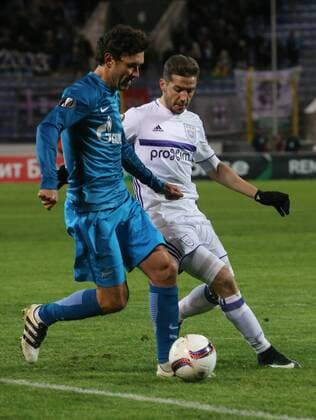 ST PETERSBURG, RUSSIA - FEBRUARY 23, 2017: Zenit St Petersburgâ€™s Yuri Zhirkov (L) and RSC Anderlecht Brusselsâ€™ Alexandru Chipciu fight for the ball in their 2016-17 UEFA Europa League Round of 32, 2nd leg football match at Petrovsky Stadium. Alexander Demianchuk TASS  TS04260F