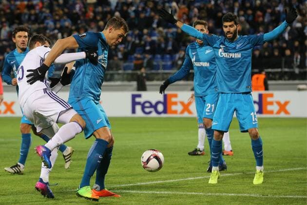 ST PETERSBURG, RUSSIA - FEBRUARY 23, 2017: RSC Anderlecht Brusselsâ€™ Uros Spajic, Zenit St Petersburgâ€™s Artem Dzyuba, Luis Neto (L-R) fight for the ball in their 2016-17 UEFA Europa League Round of 32, 2nd leg football match at Petrovsky Stadium. Alexander Demianchuk TASS  TS04260E