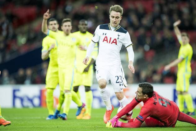 Tottenham s midfielder Christian Eriksen and Gent s goalkeeper Lovre Kalinic fight for the ball during a game between British team Tottenham and Belgian soccer team KAA Gent, return leg of the 1 16 finals of the Europa League competition, in Wembley stadium, London, Thursday 23 February 2017. Gent won the first leg 1-0. JASPERxJACOBS  x05053561x