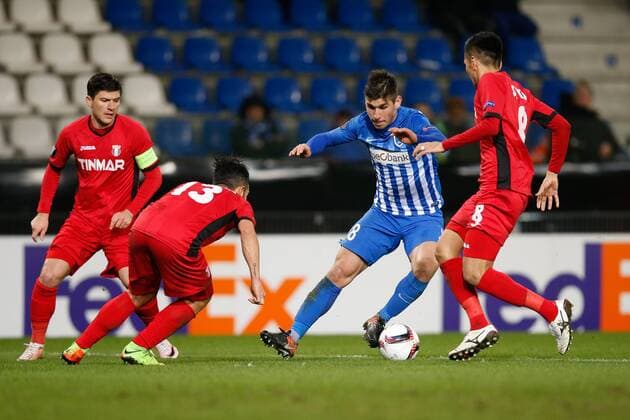 Astra Giurgiu s Junior Morais, Genk s Ruslan Malinovsky and Astra Giurgiu s Seto Takayuki fight for the ball during a game between Belgian soccer team RC Genk and Romanian Club Astra Giurgiu, return leg of the 1 16 finals of the Europa League competition Thursday 23 February 2017, in Genk. First leg result was 2-2. BRUNOxFAHY  x05053587x