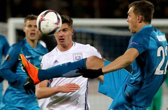 ST PETERSBURG, RUSSIA - FEBRUARY 23, 2017: Zenit St Petersburg s Artem Dzyuba (L) and RSC Anderlecht Brusselsâ€™ Leander Dendoncker fight for the ball in their 2016-17 UEFA Europa League Round of 32, 2nd leg football match at Petrovsky Stadium. Zenit St Petersburg won the game 3-1. Alexander Demianchuk TASS  TS04264C