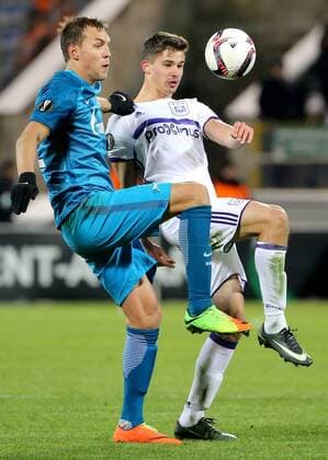 ST PETERSBURG, RUSSIA - FEBRUARY 23, 2017: Zenit St Petersburg s Artem Dzyuba (L) and RSC Anderlecht Brusselsâ€™ Leander Dendoncker fight for the ball in their 2016-17 UEFA Europa League Round of 32, 2nd leg football match at Petrovsky Stadium. Zenit St Petersburg won the game 3-1. Alexander Demianchuk TASS  TS04264F