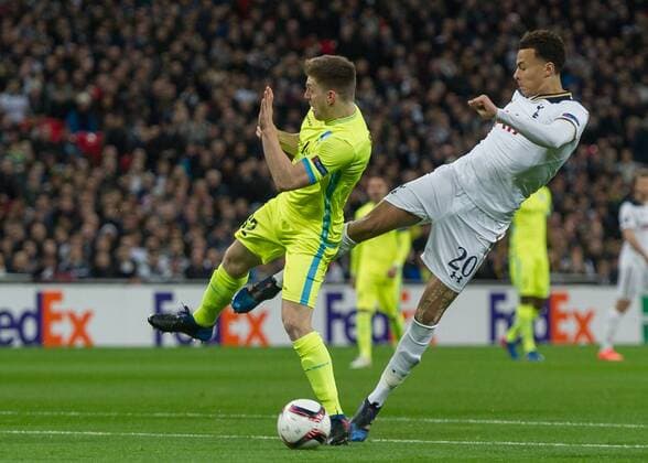 Dele Alli of Tottenham Hotspur battles with Thomas Foket of KAA Gent during the UEFA Europa League Round of 32 Game 2 match between Tottenham Hotspur and Gent at Wembley Stadium, London, England on 23 February 2017. Copyright: xVincexxMignottx 14290054