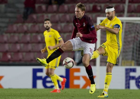 Sparta s Lukas Julis, left, and Alexandru Gatcan of Rostov in action during the Europa League round of 32 play off soccer match between AC Sparta Praha and FK Rostov in Prague, Czech Republic, on Thursday, February 23, 2017. (CTKxPhoto VitxSimanek) CTKPhotoP201702231128401  VIS 007