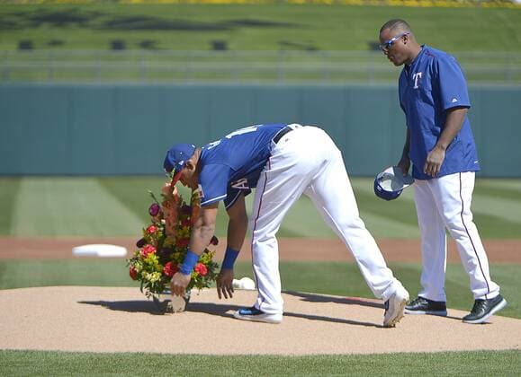 February 25, 2017 - Surprise, AZ, USA - Texas Rangers outfielder Carlos Gomez and third baseman Adrian Beltre, right, place flowers on the pitcher s mound in honor of Kansas City Royals pitcher Yordano Ventura, who died during the off season in a car crash, as the Kansas City Royals defeated the Rangers, 7-5, in a spring training game in Surprise, Ariz., on Saturday, Feb. 25, 2017. Texas Rangers spring training - ZUMAm67_ 20170225_zaf_m67_072 Copyright: xMaxxFaulknerx