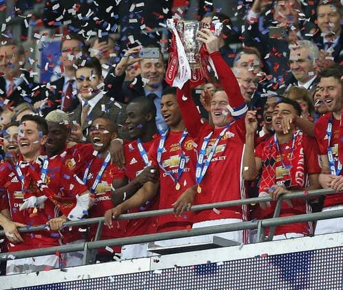 February 26th 2017, Wembley Stadium, London, England; EFL League Cup final, Southampton v Manchester United ManU Wayne Rooney of Manchester United lifts the EFL Trophy from the stands xJohnxPatrickxFletcherx  ActionPlus11851133