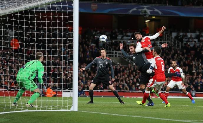 Arsenal s Olivier Giroud tussles with Munich s Mats Hummels during the Champions League Round of 16 match at the Emirates Stadium, London. Picture date March 7th, 2017 Pic David Klein Sportimage EDITORIAL USE ONLY. No use with unauthorised audio, video, data, fixture lists, club league logos or live services. Online in-match use limited to 120 images, no video emulation. No use in betting, games or single club league player publications.