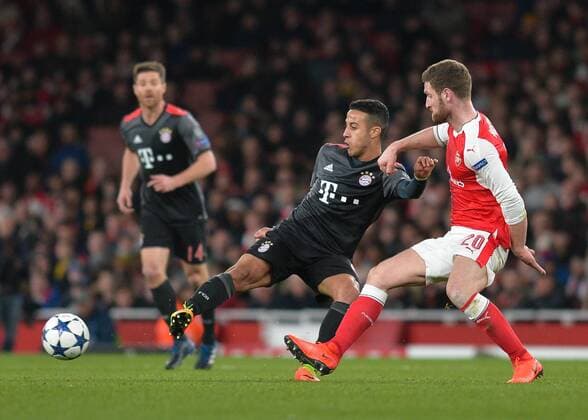 Thiago Alc‡ntara of Bayern Munich battles with Shkodran Mustafi of Arsenal during the UEFA Champions League Round of 16 Game 2 match between Arsenal and Bayern Munich at the Emirates Stadium, London, England on 7 March 2017. Copyright: xVincexMignottx 14440018