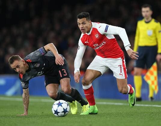 Arsenal s Alexis Sanchez tussles with Munich s Rafinha during the Champions League Round of 16 match at the Emirates Stadium, London. Picture date March 7th, 2017 Pic David Klein Sportimage EDITORIAL USE ONLY. No use with unauthorised audio, video, data, fixture lists, club league logos or live services. Online in-match use limited to 120 images, no video emulation. No use in betting, games or single club league player publications.