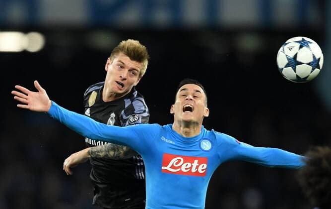 NAPLES, March 7, 2017 -- Tony Kroos(L) of Real Madrid vies with Jose Callejon of Napoli during the UEFA Champions League Round of 16 second leg match between Napoli and Real Madrid in Naples, Italy, March 7, 2017. Real Madrid won 3-1 advanced to the quarterfinal with 6-2 on aggregate. ) (SP)ITALY-NAPLES-SOCCER-UEFA-UCL-REAL MADRID VS NAPOLI AlbertoxLingria 