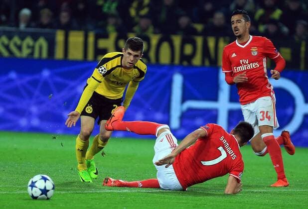 DORTMUND, March 8, 2017 -- Chirstian Pulisic(L) of Borussia Dortmund chasing the ball during the UEFA Champions League Round of 16 second leg match between Borussia Dortmund and SL Benfica at Signal Iduna Park in Dortmund, Germany, on March 8, 2017. Borussia Dortmund won 4-0 and advanced to the quarterfinal with 4-1 on aggregate. ) (SP)GERMANY-DORTMUND-SOCCER-UEFA-UCL-DORTMUND VS BENFICA LuoxHuanhuan 