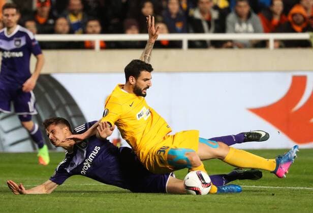 Anderlecht s Leander Dendoncker and Apoel s Giorgos Merkis fight for the ball during a soccer game between Cypriot club APOEL FC and Belgian team RSC Anderlecht in Nicosia, Cyprus, Thursday 09 March 2017, the first leg of the 1 8 finals of the Europa League competition. VIRGINIExLEFOUR  x05061841x