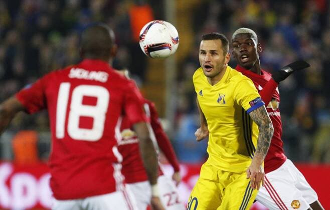 ROSTOV-ON-DON, RUSSIA - MARCH 9, 2017: FC Manchester United ManU s Ashley Young (L), Paul Pogba (R) and FC Rostov s Fyodor Kudryashov (C) fight for the ball in Leg 1 of their 2016-17 UEFA Europa League Round of 16 football match at Olimp-2 Stadium. The game ended in a 1-1 draw. Valery Matytsin TASS  TS043C4F