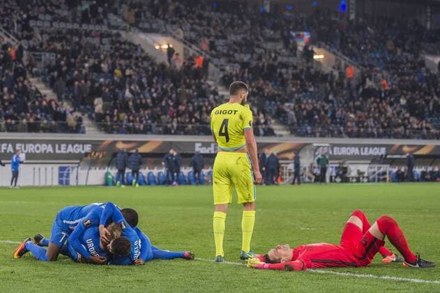 KRC Genk celebrate the goal while Samuel Gigot of KAA Gent and goalkeeper Lovre Kalinic of KAA Gent are disappointedduring the UEFA Europa League round of 16 match between KAA Gent and KRC Genk on March 09, 2017 at the Ghelamco Arena in Gent, Belgium. KAA Gent v KRC Genk UEFA Europa League 2016 2017 xVIxGerritxvanxKeulenxIVx 7293966