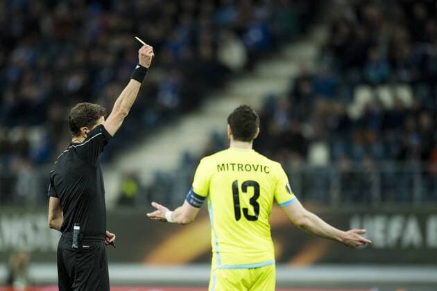 Gent s Stefan Mitrovic receives a yellow card from the referee during a soccer game between Belgian teams KAA Gent and KRC Genk, Thursday 09 March 2017 in Gent, the first leg of the 1 8 finals of the Europa League competition. JASPERxJACOBS  x05062023x