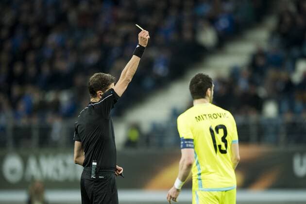 Gent s Stefan Mitrovic receives a yellow card from the referee during a soccer game between Belgian teams KAA Gent and KRC Genk, Thursday 09 March 2017 in Gent, the first leg of the 1 8 finals of the Europa League competition. JASPERxJACOBS  x05062024x