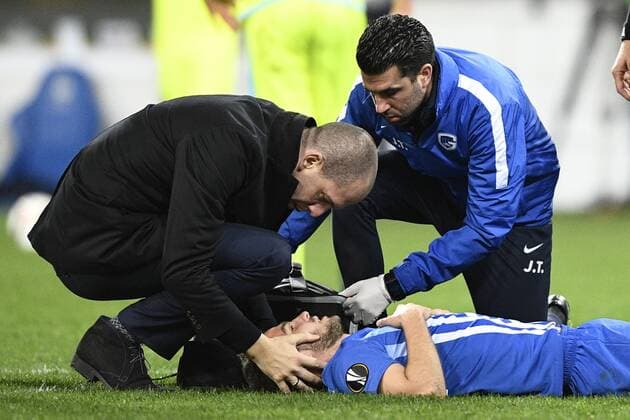 Genk s doctor Stijn Indeherberge, Genk s Siebe Schrijvers and Genk s physiotherapist Jan Theunis pictured during a soccer game between Belgian teams KAA Gent and KRC Genk, Thursday 09 March 2017 in Gent, the first leg of the 1 8 finals of the Europa League competition. YORICKxJANSENS  x05062036x