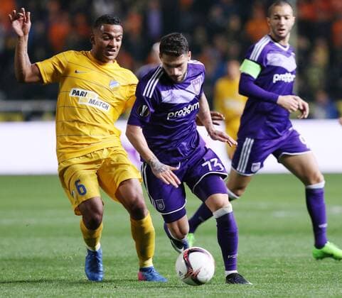 (170310) -- NICOSIA, March 9, 2017 -- APOEL s Lorenzo Ebecilio(L) vies with Anderlecht s Nicolae Stanciu during the Europa League Round of 16 first leg match between Anderlecht and APOEL in Nicosia, Cyprus, on March 9, 2017. Anderlecht won 1-0.) (SP)CYPRUS-NICOSIA-SOCCER-UEFA-EUROPA LEAGUE SakisxSavvides 