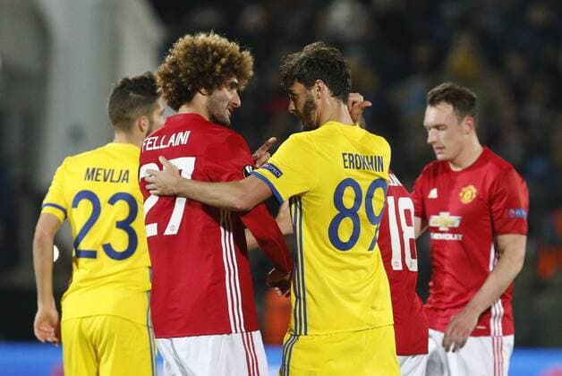 ROSTOV-ON-DON, RUSSIA - MARCH 9, 2017: FC Manchester United ManU s Marouane Fellaini and FC Rostov s Alexander Yerokhin (L-R front) talking after Leg 1 of their 2016-17 UEFA Europa League Round of 16 football match at Olimp-2 Stadium. The game ended in a 1-1 draw. Valery Matytsin TASS  TS043C62