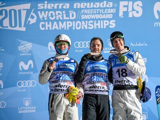 SNOWBOARD, FREESTYLE SKIING - FIS WC 2017 SIERRA NEVADA,SPAIN,10.MAR.17 - SNOWBOARD, FREESTYLE SKIING - FIS Freestyle Ski and Snowboard World Championships, free ski aerials, men ladies final, award ceremony. Image shows Guangpu Qi (CHN), Jonathon Lillis (USA) and David Morris (AUS). GEPAxpictures xOliverxLerch