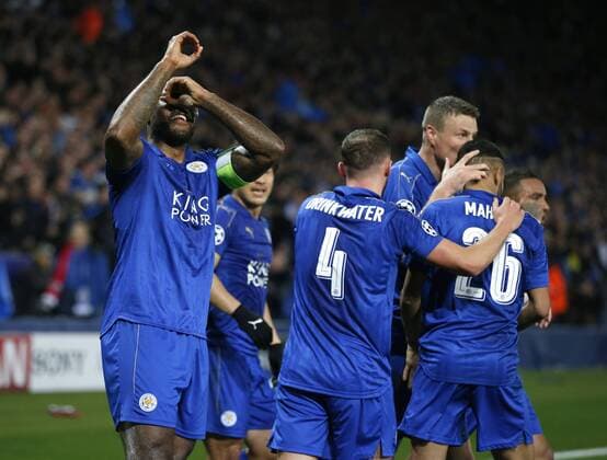 Wes Morgan of Leicester City (l) celebrates scoring the first goal during the UEFA Champions League Round of 16 - 2nd Leg match at the King Power Stadium, Leicester. Picture date: March 14th 2017. Pic credit should read: Simon Bellis Sportimage EDITORIAL USE ONLY. No use with unauthorised audio, video, data, fixture lists, club league logos or live services. Online in-match use limited to 120 images, no video emulation. No use in betting, games or single club league player publications.
