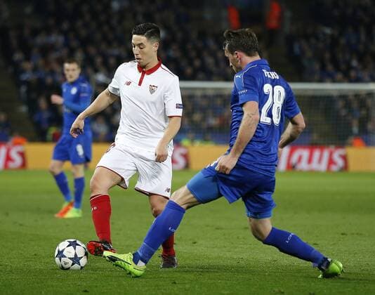 Samir Nasri of Sevilla in action with Christian Fuchs of Leicester City during the UEFA Champions League Round of 16 - 2nd Leg match at the King Power Stadium, Leicester. Picture date: March 14th 2017. Pic credit should read: Simon Bellis Sportimage EDITORIAL USE ONLY. No use with unauthorised audio, video, data, fixture lists, club league logos or live services. Online in-match use limited to 120 images, no video emulation. No use in betting, games or single club league player publications.