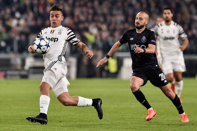 March 14, 2017 - Turin, Italy - Paulo Dybala forward of Juventus FC is challenged by Porto s Portuguese midfielder Andre Andre during the UEFA Champions League Round of 16 2st leg soccer match between Juventus FC and FC Porto, at Juventus Stadium in Torino on March 14, 2017. Juventus v FC Porto - UEFA Champions League Round of 16: Second Leg  - ZUMAn230 20170314_zaa_n230_247 Copyright: xDpix