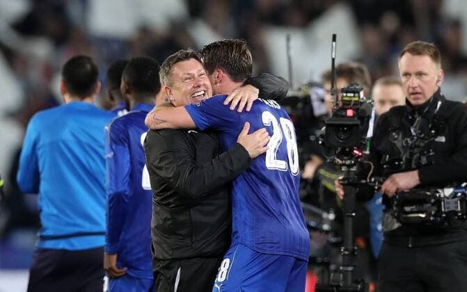Football - 2016 2017 UEFA Champions League - Round of Sixteen, Second Leg: Leicester City 1 vs. Sevilla 2 Craig Shakespeare, Manager of Leicester City celebrates with Christian Fuchs of Leicester City after the match at the King Power Stadium. 