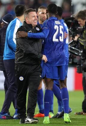 Football - 2016 2017 UEFA Champions League - Round of Sixteen, Second Leg: Leicester City 1 vs. Sevilla 2 Craig Shakespeare, Manager of Leicester City and Wilfred Ndidi of Leicester City celebrate after the match at the King Power Stadium. 