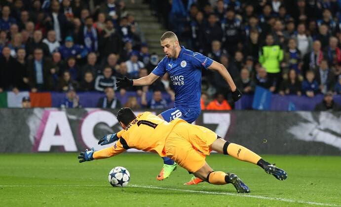 Football - 2016 2017 UEFA Champions League - Round of Sixteen, Second Leg: Leicester City 1 vs. Sevilla 2 Islam Slimani of Leicester City has a shot saved by Sergio Rico of Sevilla during the match at the King Power Stadium. 