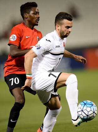 (170315) -- DOHA, March 15, 2017 -- Qatari Rayyan s Musaab Khidir Mohamed (L) vies with Iranian Persepolis FC s Soroush Rafieitelgary during the AFC Asian Champions League group D football match at the Jassim Bin Hamad Stadium in Doha, capital of Qatar, March 14, 2017. Qatar s Rayyan won 3-1. ) (SP)QATAR-DOHA-AFC-ASIAN CHAMPIONS LEAGUE Nikku 