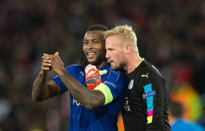 (170315) -- LEICESTER, March 15, 2017 -- Wes Morgan (L) and Kasper Schmeichel of Leicester City celebrate victory after the round of 16 second Leg Champions League match between Leicester City and Sevilla FC at the King Power Stadium in Leicester, England on March 14, 2017. Leicester City won the match 2-0 to enter the semifinal with 3-2 on aggregate. ) (SP)BRITAIN-LEICESTER-CHAMPIONS LEAGUE-ROUND OF 16-LEICESTER CITY VS SEVILLA FC JonxBuckle 