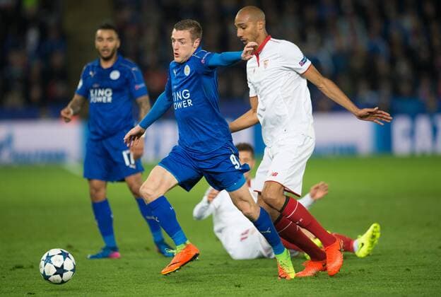 (170315) -- LEICESTER, March 15, 2017 -- Jamie Vardy (C) of Leicester City is challenged by Steven N Zonzi of Sevila FC during the round of 16 second Leg Champions League match between Leicester City and Sevilla FC at the King Power Stadium in Leicester, England on March 14, 2017. Leicester City won the match 2-0 to enter the semifinal with 3-2 on aggregate. ) (SP)BRITAIN-LEICESTER-CHAMPIONS LEAGUE-ROUND OF 16-LEICESTER CITY VS SEVILLA FC JonxBuckle 
