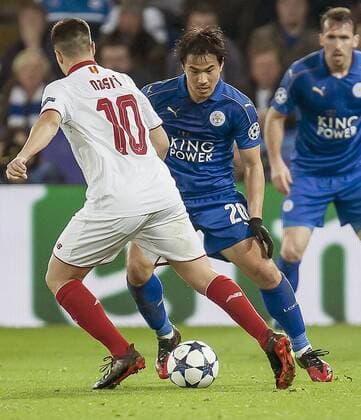 Soccer: Leicester reach Champions League q finals Leicester City s Shinji Okazaki (C) and Samir Nasri (L) of Sevilla vie for the ball in the second leg of the European Champions League round of 16 on March 14, 2017. Leicester won 2-0 and progressed with an aggregate of 3-2. 